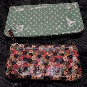 Three Fossil accessories/ makeup bag